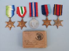 A collection of WWII medals to E G Dennis comprising 1939/1945 Star, Atlantic Star, Burma Star,