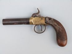 Percussion hammer action pistol with engraved brass lock, stylised dolphin hammer,