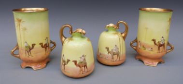 Two pairs of early 20thC Royal Doulton vases with print and enamel decoration of desert scenes and