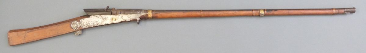 Indian matchlock torador gun with engraved lock plates, painted stock, shaped trigger,