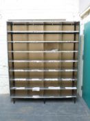 A large cubbyhole shelf unit with shopfitting steel frame and 32 cubbyholes,