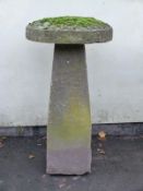 A natural stone staddle stone,