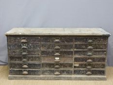 A large painted pine shopfitting/haberdashery chest of eighteen drawers (H87 x L182 x D62cm)