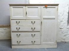 A 19thC painted pine housekeeper's cupboard with four graduated drawers (H147 x W150 x D52cm)