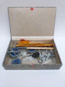 A collection of loose Meccano parts including wheels.