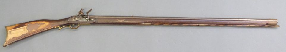 American flintlock Kentucky rifle with engraved Roman type lock and hammer, brass trigger guard,