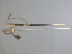 Victorian officer's sword with ornate brass hilt & guard, wired handle and tassel,