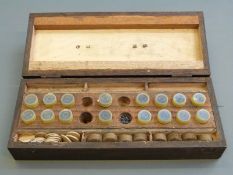 A muzzle loader re-loading set containing shot and wads of various calibres,