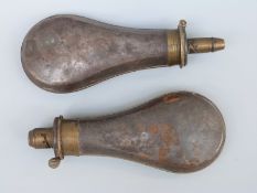 Two metal and brass powder flasks one Sykes stamped 'Extra Quality' the other Dixon & Sons,