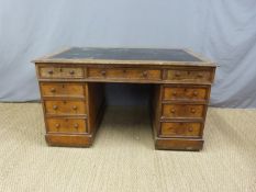 A leather inset oak partner's desk,