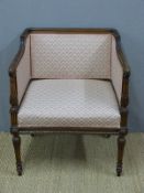 A late 19th/20thC upholstered mahogany salon armchair with finely carved detail including oak leaf