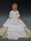 An Armand Marseille bisque headed baby doll with open mouth,