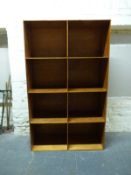 A set of eight wooden cubbyholes/shelf unit,