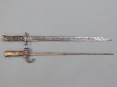 A 19thc 1886 pattern French bayonet with white metal hilt and quillion, blade length 43cm,