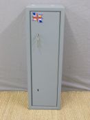 A small gun cabinet / safe with two sets of keys and mounting bolts together with a faux leather