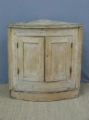 A vintage pine bow fronted corner cabinet (H83cm)