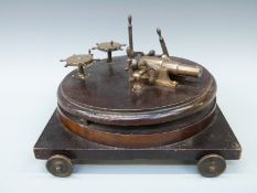 A working bronze model of a cannon with 3.