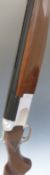 Winchester Select Sporting 12 bore over and under ejector shotgun with chequered grip and forend,