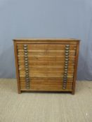 A collector's/haberdashery mahogany chest of eighteen slim drawers with brass cup handles (H98 x