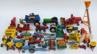 Thirty-three Britains and similar diecast and plastic model farm vehicles,