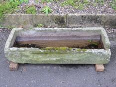 A carved natural stone trough (L105 x W44 x H20cm)