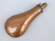 Copper and brass powder flask stamped 'Snider' under a gun logo, 19cm long.