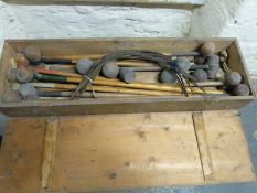 A wooden cased vintage croquet set