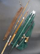 A collection of fishing rods and equipment to include keep net etc