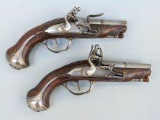 A pair of French flintlock hammer action pocket pistols,
