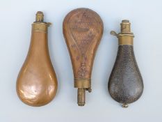 Three G & J W Hawksley of Sheffield powder flasks one with embossed decoration,