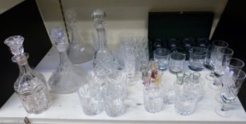 A pair of cut glass ship's decanters, further decanters and cut glass,