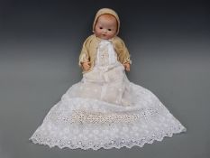 An Armand Marseille bisque headed baby doll with open mouth,