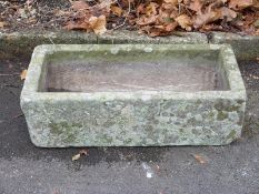 A small rectangular carved natural stone trough (L71 x W36 x H20cm)