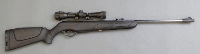 Gamo shadow DX .22 air rifle with Hawke Sport HD 4 x 32 scope, serial number 04-IC-110H2-11.