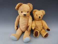 Two vintage golden mohair teddy bears both with cocked wrists and 90° feet
