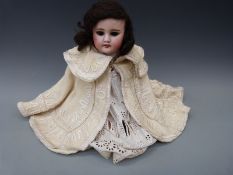A French SFBJ bisque headed girl doll with open mouth,