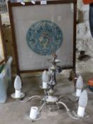 A fire screen and a chandelier