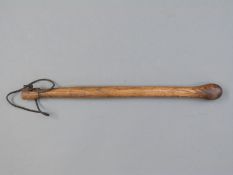 A wooden knobkerrie in the Zulu style,