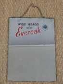 A vintage motorcycle helmet advertising mirror 