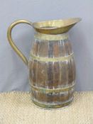 A coopered oak and brass jug (H54cm)