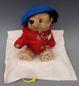 Steiff Teddy bear Paddington Bear with brown mohair, red coat, blue hat and jointed limbs,