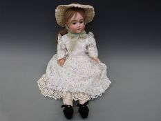 A Heinrich Handwerck bisque headed girl doll with open mouth,