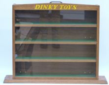 Dinky Toys wooden model car display cabinet with four baize lined shelves and carry handle,