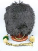 A Foot Guards bearskin hat,