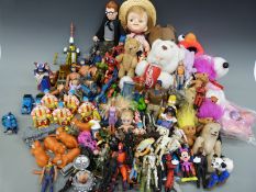 A collection of dolls and bears, some novelty, film and TV related.