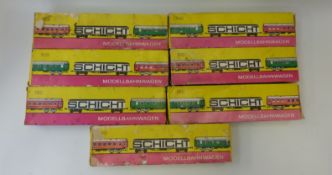 Seven Schicht HO/00 gauge carriages and coaches, all in original boxes.