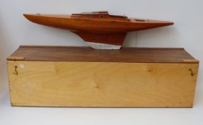 A wooden model of a sailing/ pond yacht on stand in wooden travel box.