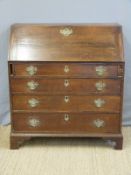 A Georgian oak bureau with four straight graduated drawers,