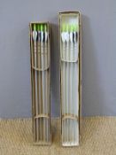 Two boxes of eight Silver Streak archery arrows.