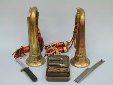 A collection of military items to include two Royal Artillery brass and copper crested bugles,